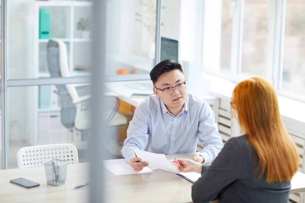HR Manager Interviewing Young Woman